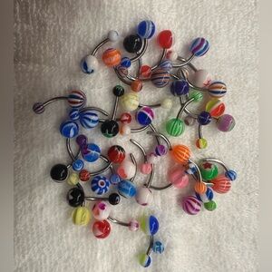 Very colorful belly piercings!